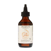 Brown bottle of afrocenchix Soothe Scalp Oil on a white background