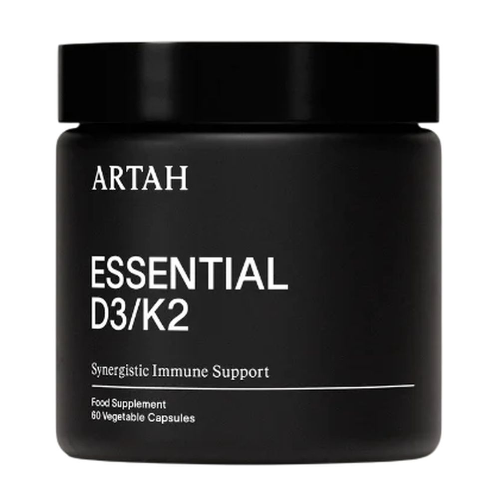 Black container of ARTAH Essential D3/K2 supplement on a white background