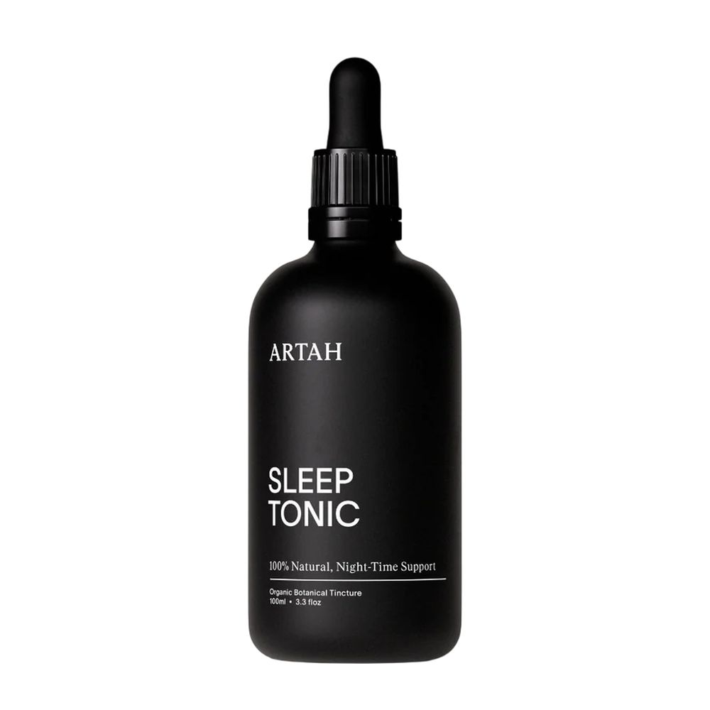 Black bottle of ARTAH Sleep Tonic on a white background