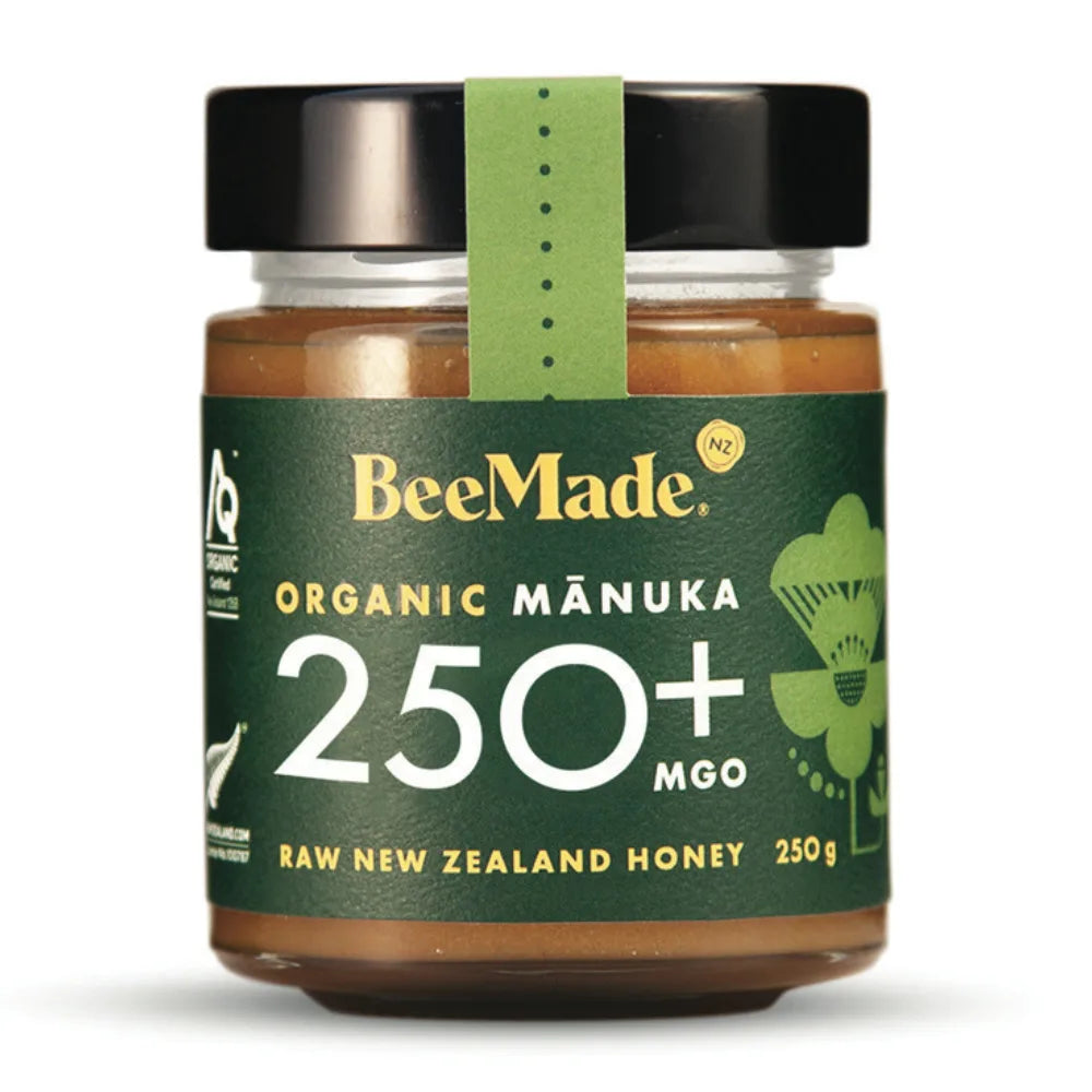 Jar of BeeMade Organic Manuka honey with a green label on a white background