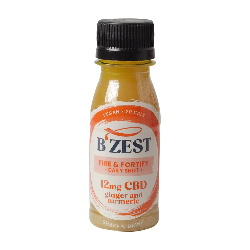 Bottle of B'Zest CBD shot with ginger and turmeric on a white background