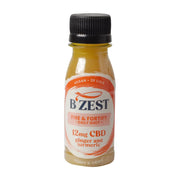 Bottle of B'Zest CBD shot with ginger and turmeric on a white background