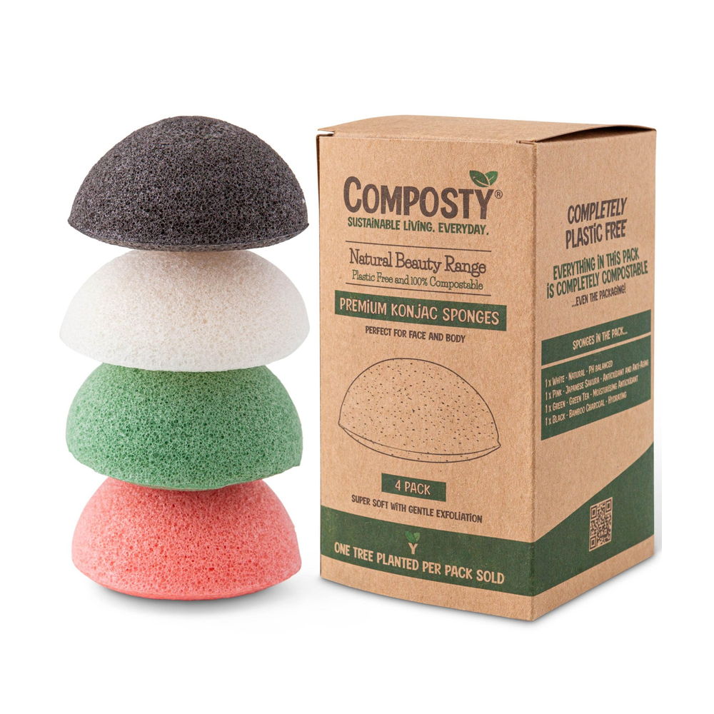 Stack of four colored konjac sponges with Composty packaging on a white background