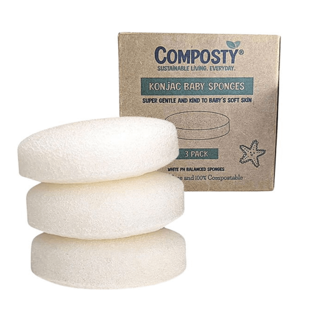 Three white baby sponges stacked with a Composty branded box in the background.
