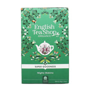 Green packaging of English Tea Shop Organic Mighty Matcha tea with decorative elements on a white background