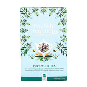 English Tea Shop organic pure white tea packaging with decorative elements on a light blue background