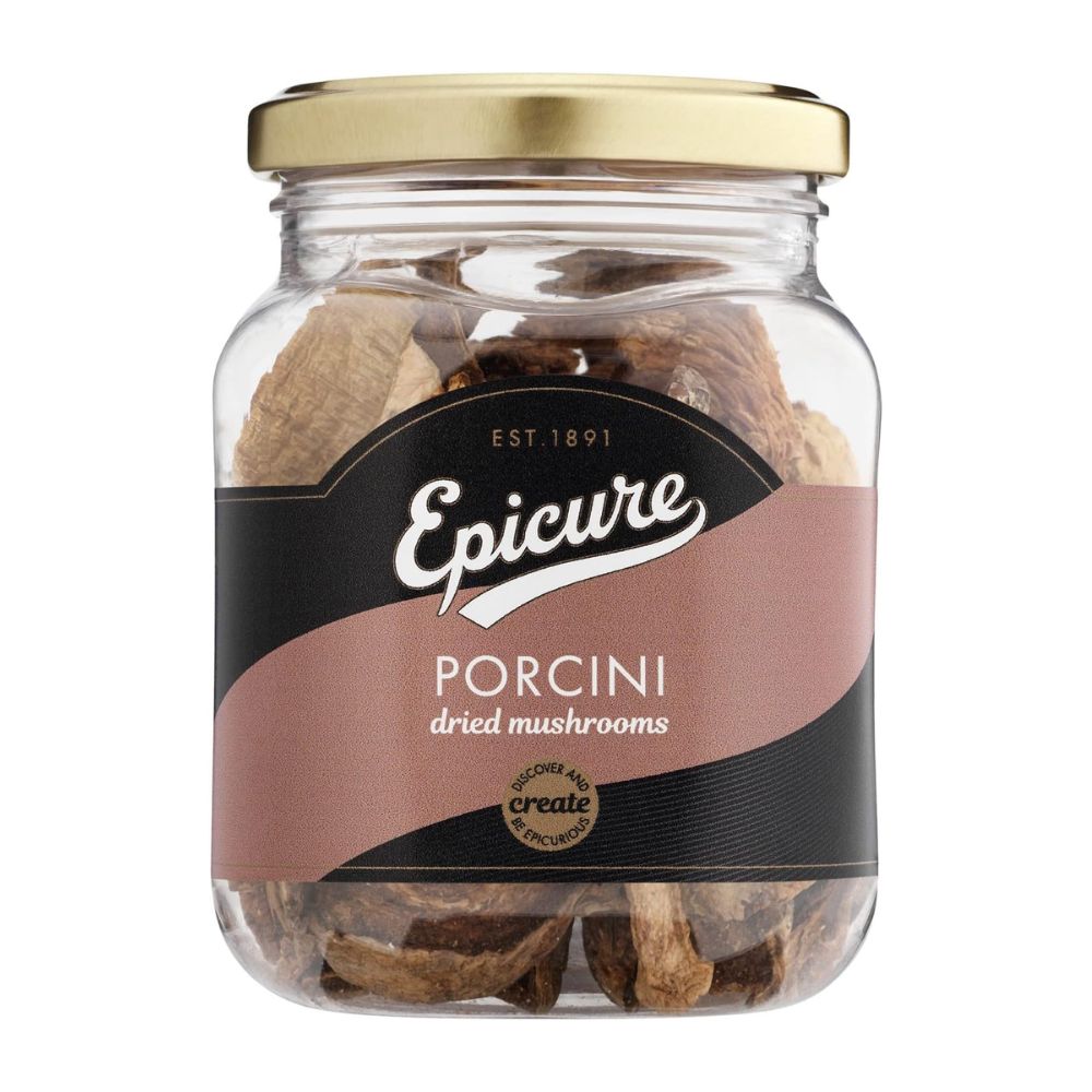Jar of Epicure Porcini dried mushrooms with a gold lid on a white background