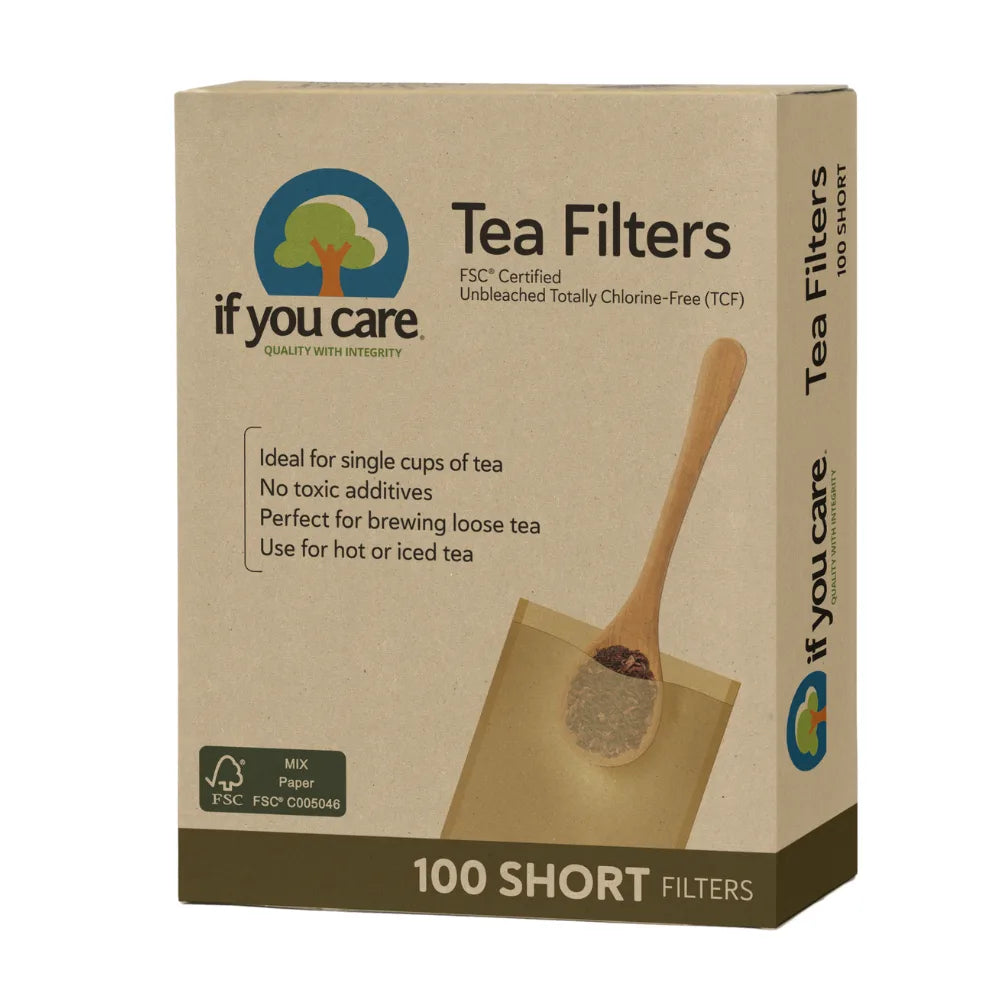 Box of if you care tea filters with a wooden spoon on a beige background