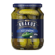Jar of Krakus pickled dill cucumbers on a white background