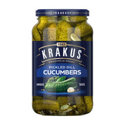 Jar of Krakus pickled dill cucumbers on a white background