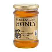 Jar of pure English honey from Littleover Apiary on a white background