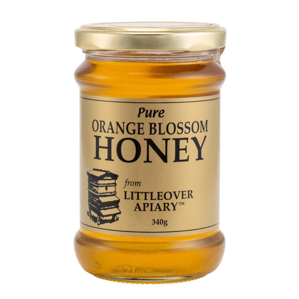 Jar of pure orange blossom honey from Littleover Apiary on a white background