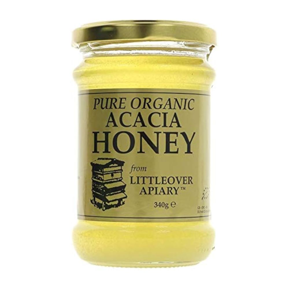 Jar of pure organic acacia honey from Littleover Apiary on a white background