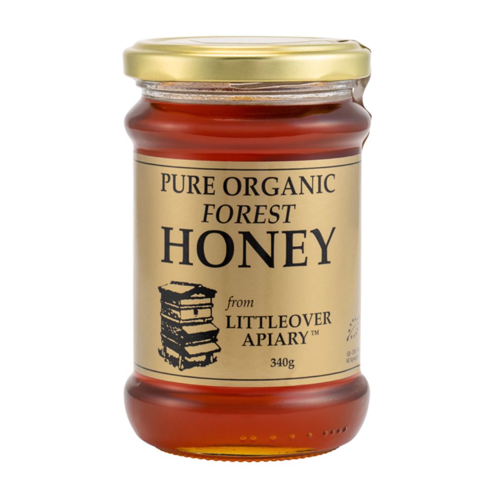 Jar of pure organic forest honey from Littleover Apiary on a white background