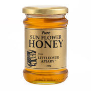 Jar of pure sunflower honey from Littleover Apiary on a white background