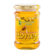 Jar of honey from Littleover Apiary on a white background