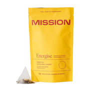 Yellow 'Mission' energising tea package with a pyramid tea bag on a white background