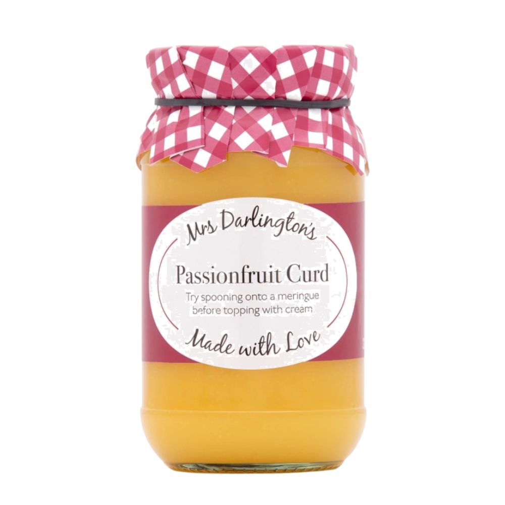 Jar of passionfruit curd with a pink checkered lid on a white background