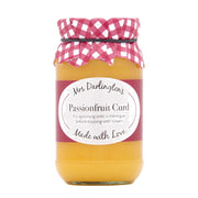 Jar of passionfruit curd with a pink checkered lid on a white background