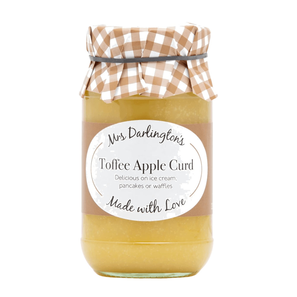 Jar of toffee apple curd with a checkered lid on a white background