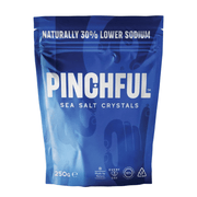 Blue package of Pinchful sea salt crystals on a white background