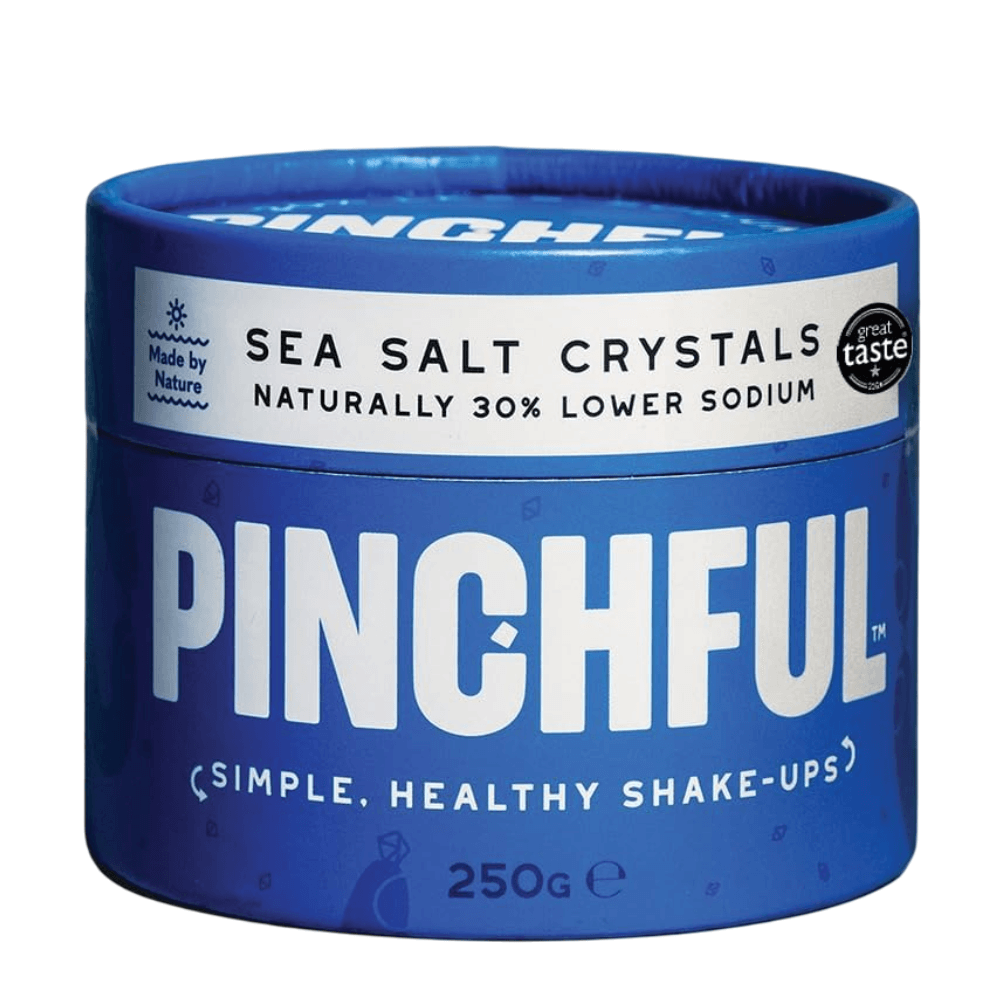 Blue container of Pinchful sea salt crystals on a white background