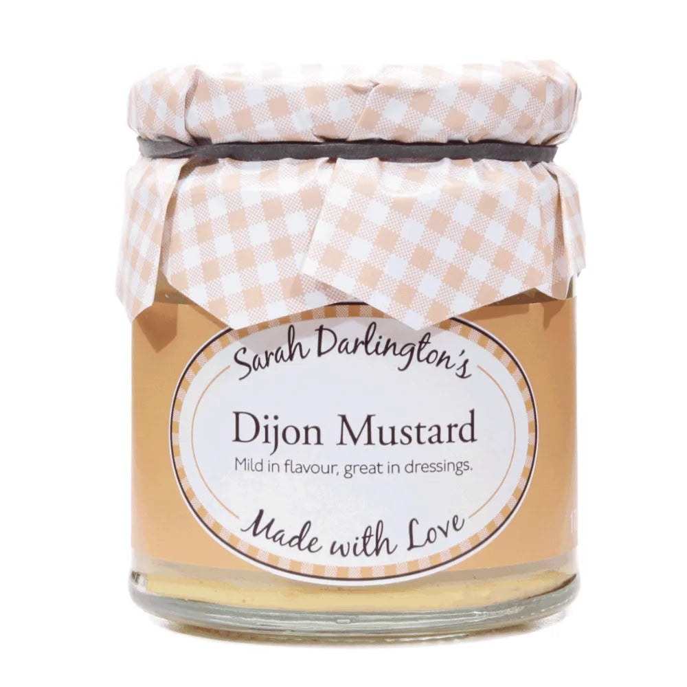Jar of Dijon Mustard with a checkered lid on a white background