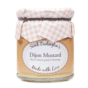 Jar of Dijon Mustard with a checkered lid on a white background