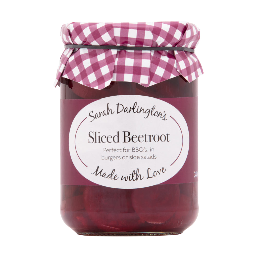 Jar of sliced beetroot with a checkered lid on a white background