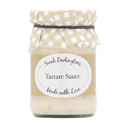 Jar of Sarah Darlington's Tartare Sauce with a checkered lid on a white background