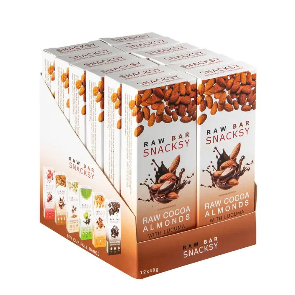 Display of Snacksy Raw Bar packaging with raw cocoa almonds and lucuma on a white background