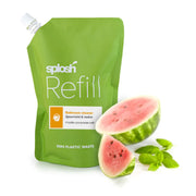 Green 'splash Refill' pouch with watermelon slices and basil leaves on a white background