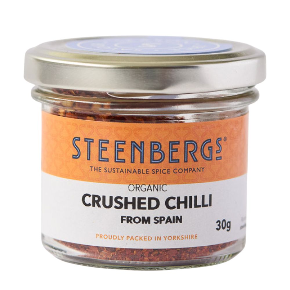 Jar of Steenbergs organic crushed chilli on a white background