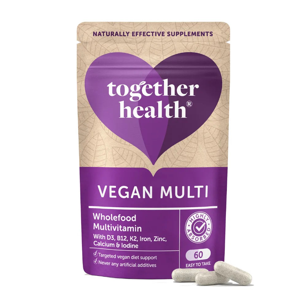 Vegan multivitamin package with purple heart logo and 'Together Health' branding on a beige background.