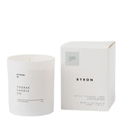 White candle and packaging with 'Byron' branding on a white background