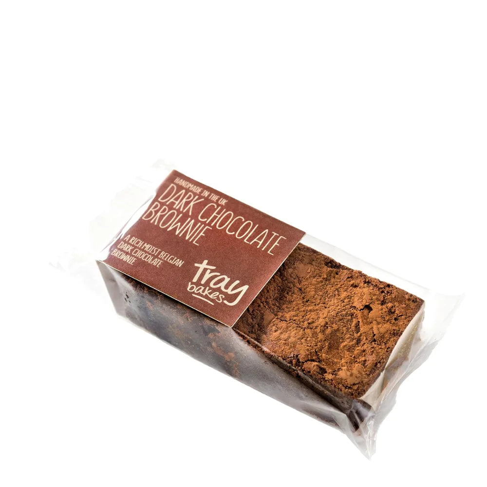 Packaged dark chocolate brownie with 'tray cakes' branding on a white background