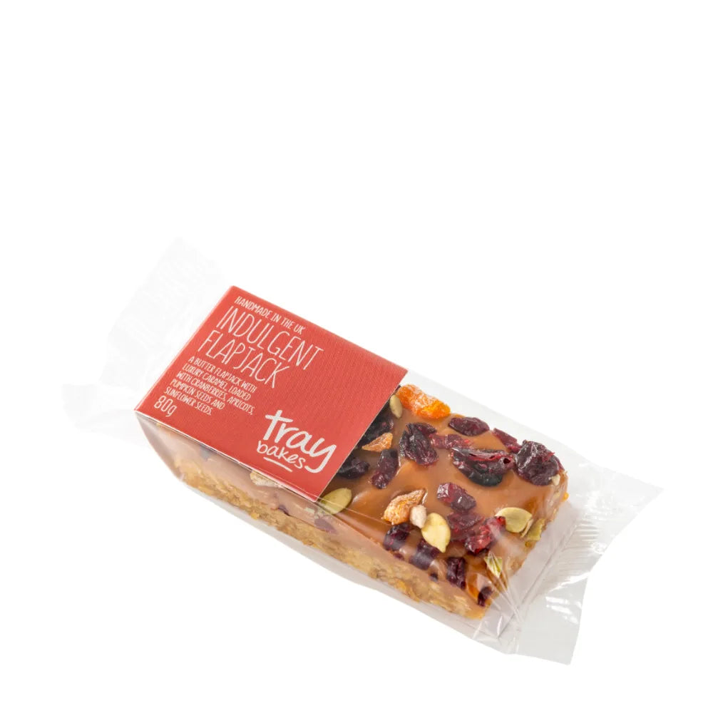 Packaged Indulgent Flapjack with visible ingredients on a white background