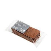 Packaged salted caramel brownie with a clear wrapper on a white background