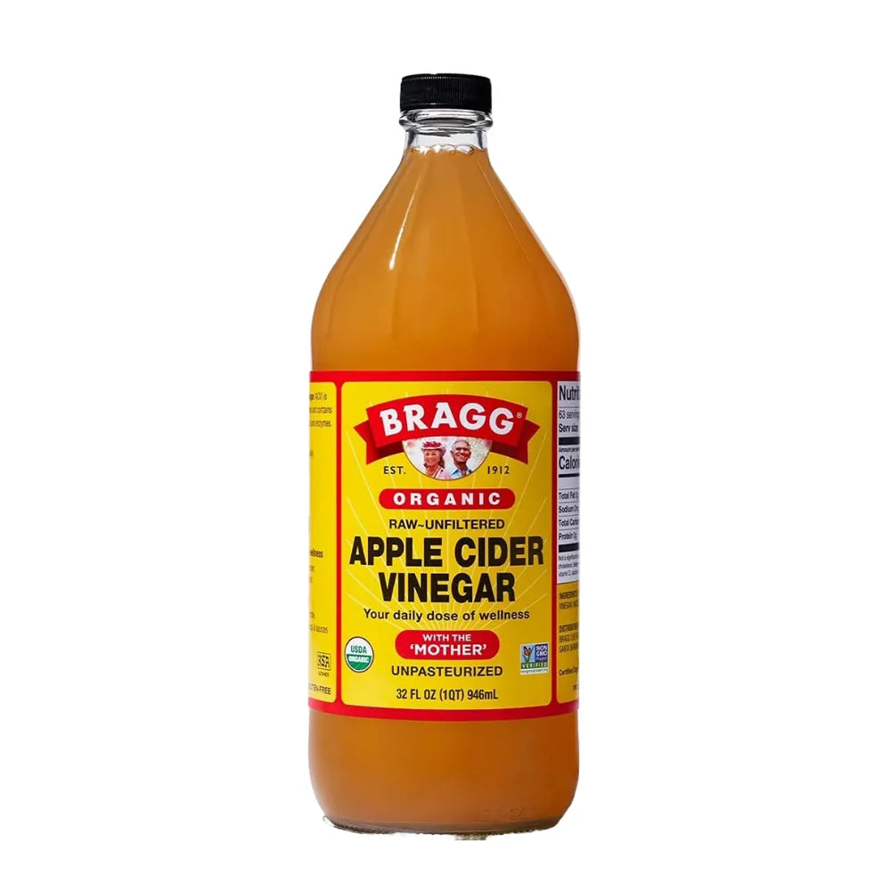 Bottle of Bragg Organic Apple Cider Vinegar on a white background