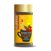 Clipper coffee jar with yellow label on a white background