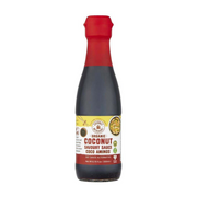 Bottle of Organic Coconut Savoury Sauce with a red cap on a white background