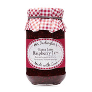 Jar of Mrs. Darlington's Raspberry Jam with a checkered lid on a white background